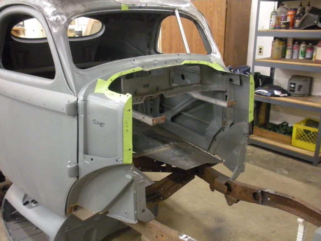 A car that is being worked on in the shop.