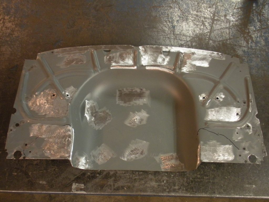A metal object with some paint on it