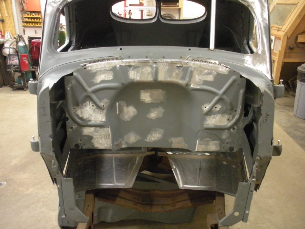 A car that is being worked on in the shop.