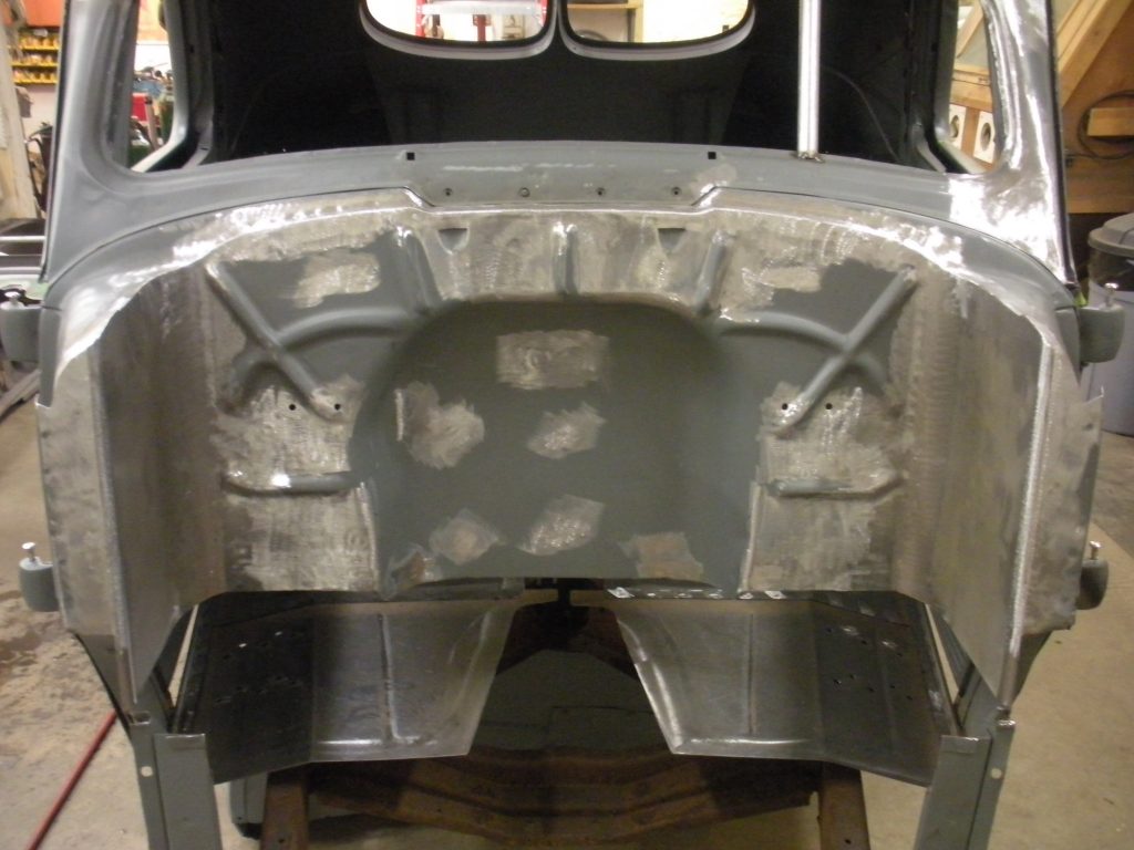 A close up of the back end of an old car