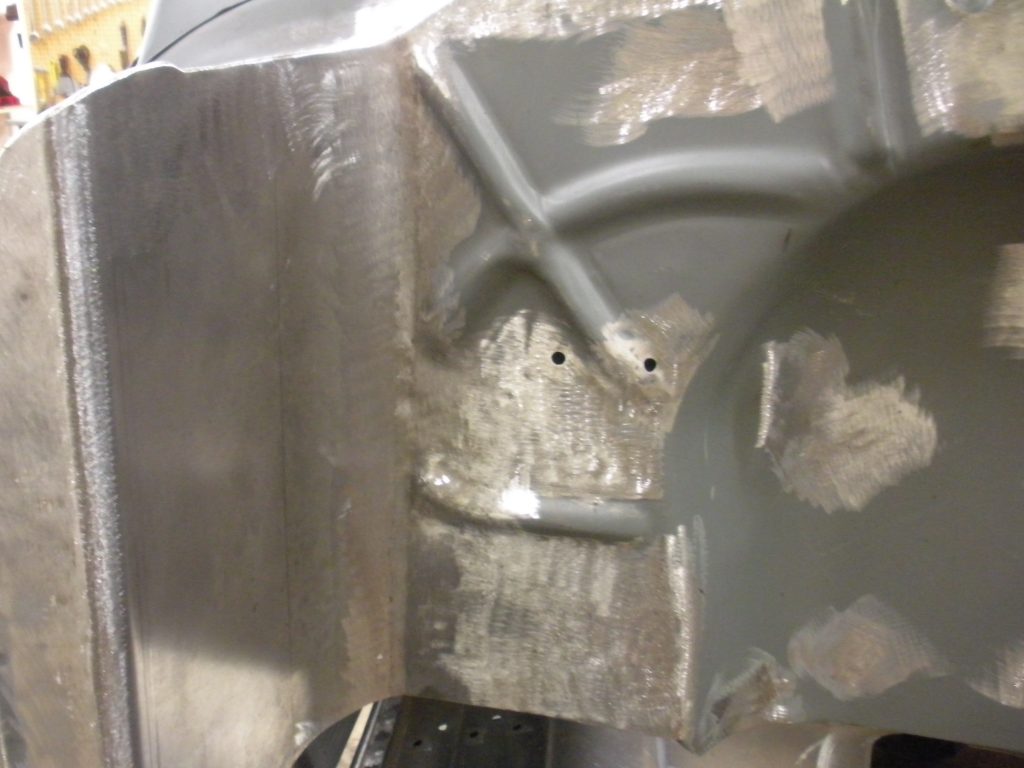 A close up of the metal part of a vehicle.