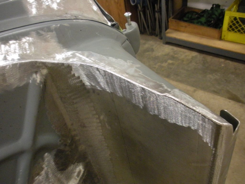 A metal piece of art that is being worked on.
