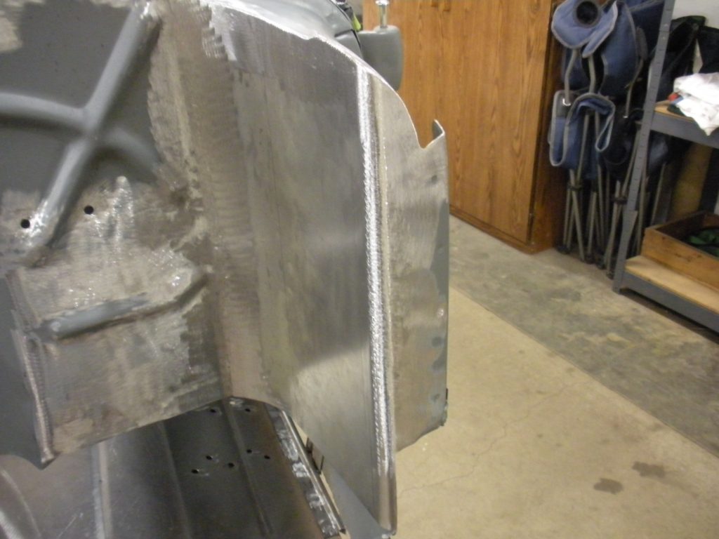 A metal piece of art that is being worked on.