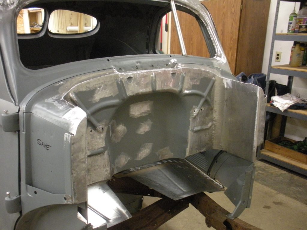 A car that is being worked on in the shop.