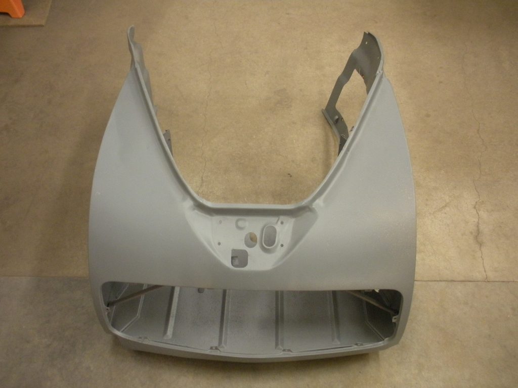 A silver metal object sitting on top of the floor.