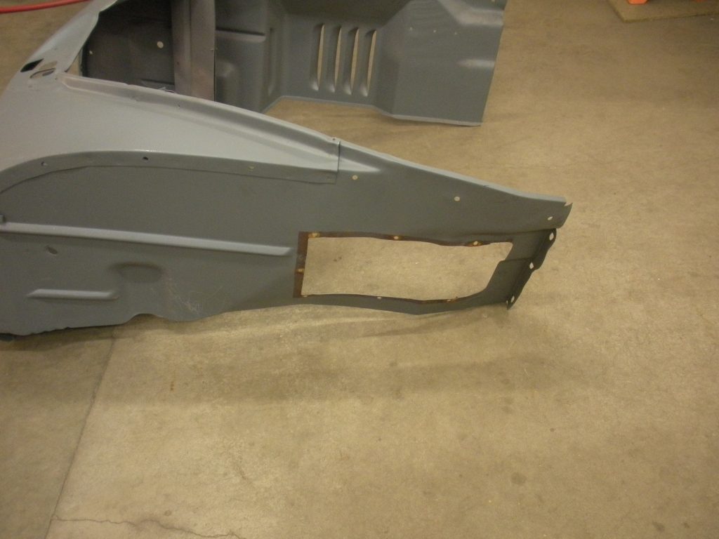 A piece of metal that is sitting on the floor.