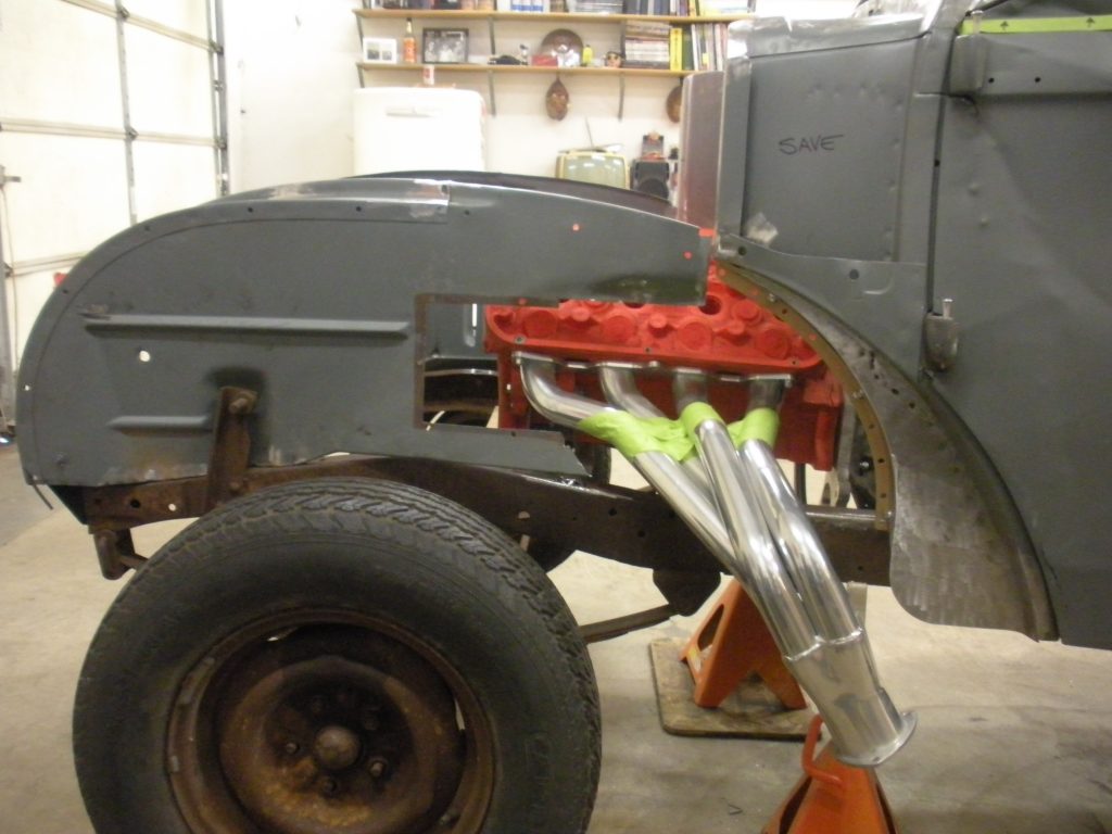 A truck with the front end of it being worked on.