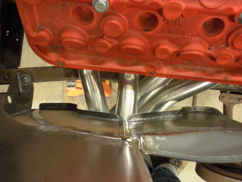 A close up of the bottom part of an industrial machine.