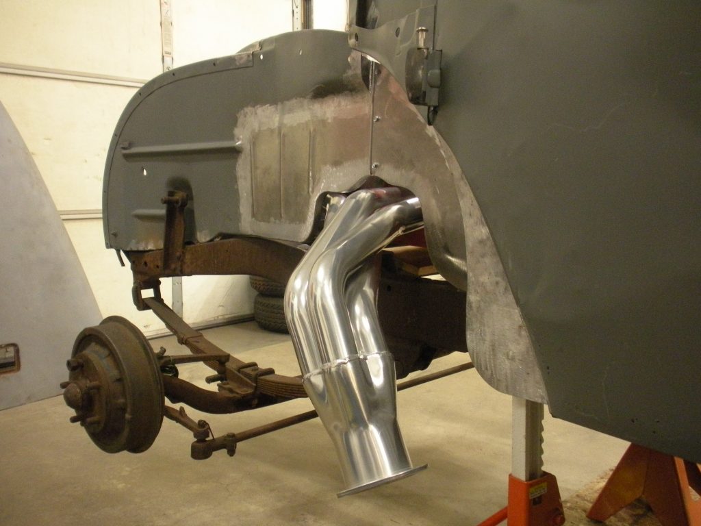 A car with the front end being worked on.