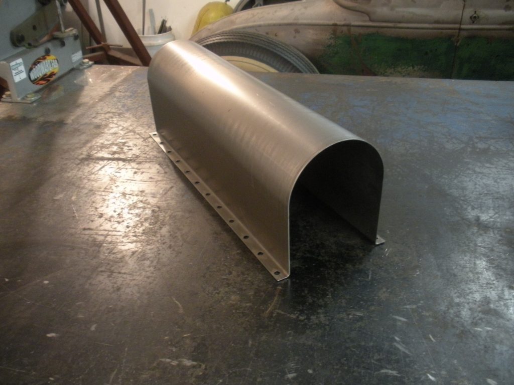 A metal tube sitting on top of a table.