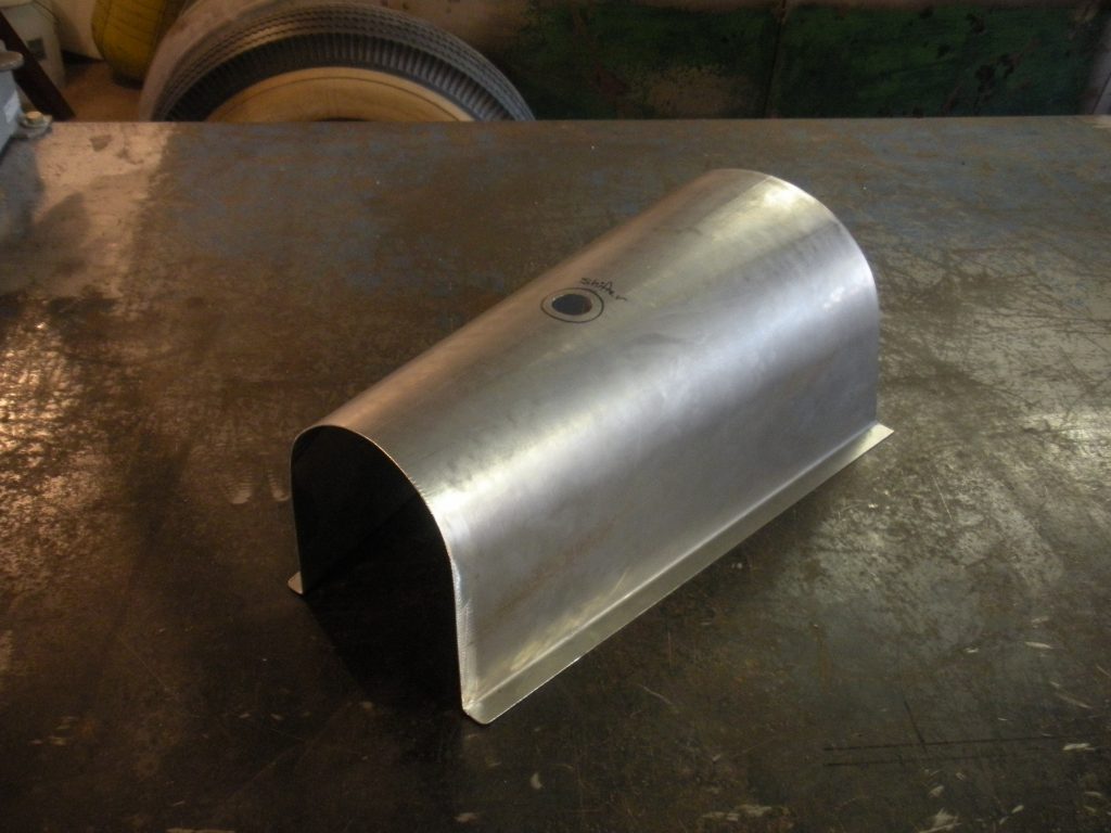 A metal object sitting on top of a table.