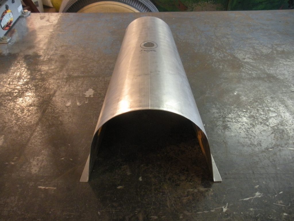 A metal tube sitting on top of a table.