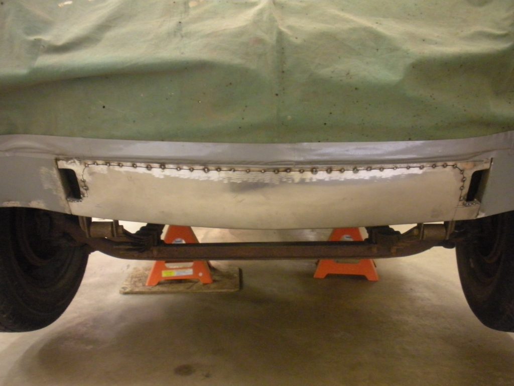 A car that is sitting in the garage.