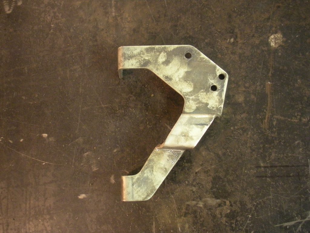 A metal piece of art that is shaped like the number seven.