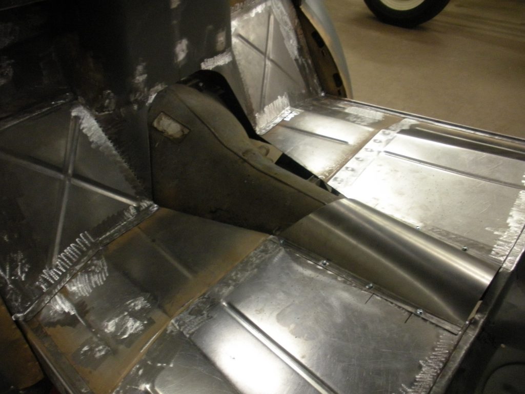 A close up of the bottom of an airplane.