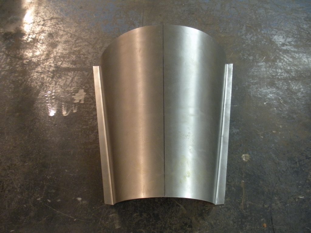 A metal wall light on the ground