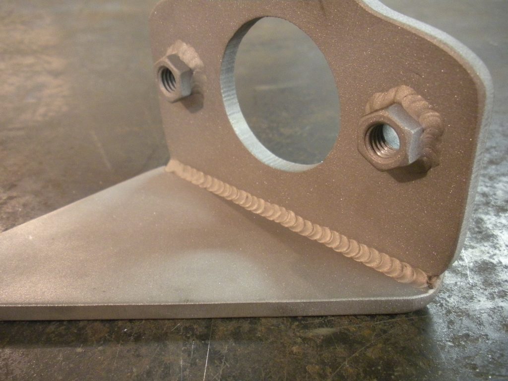 A metal object with nuts and bolts on it.