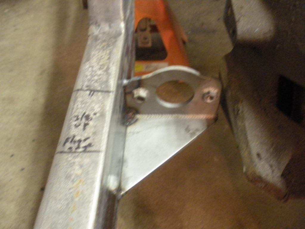 A metal object with some writing on it