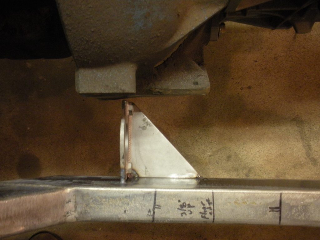 A metal object with some writing on it