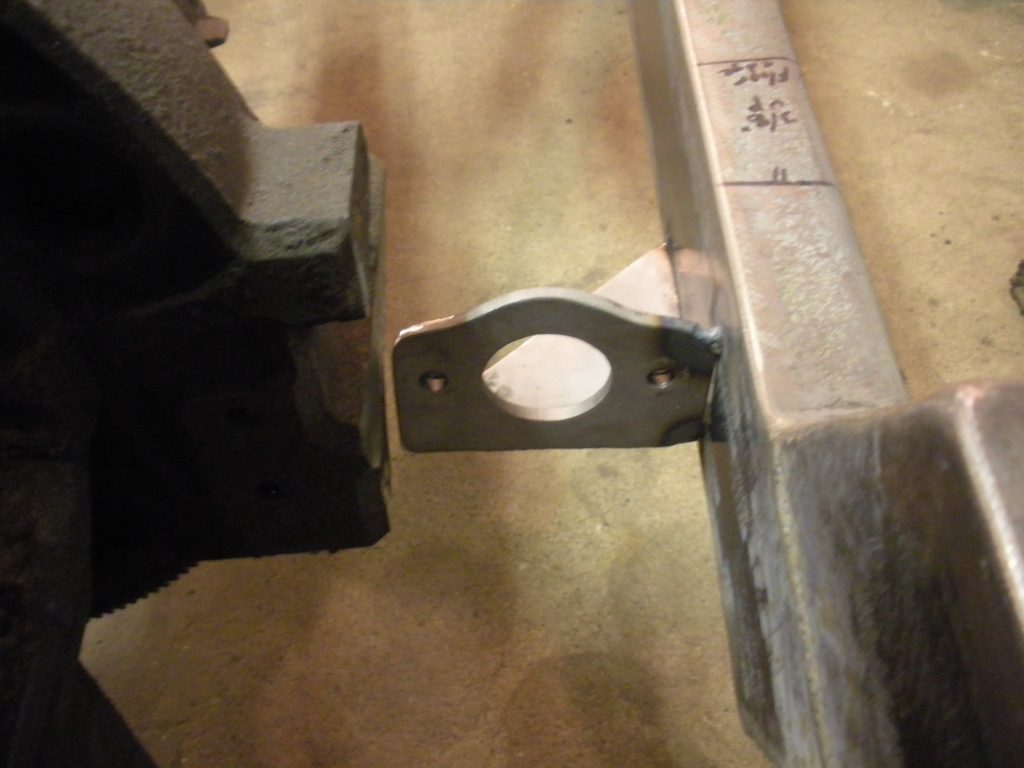 A piece of metal that is sitting on the ground.