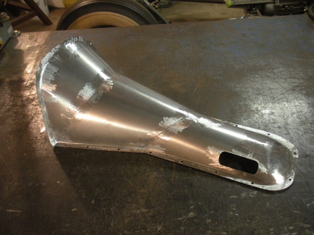A metal piece of art that is being made.