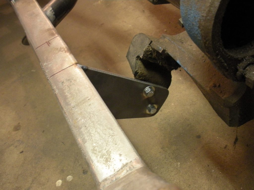 A metal piece that is being cut with an angle grinder.