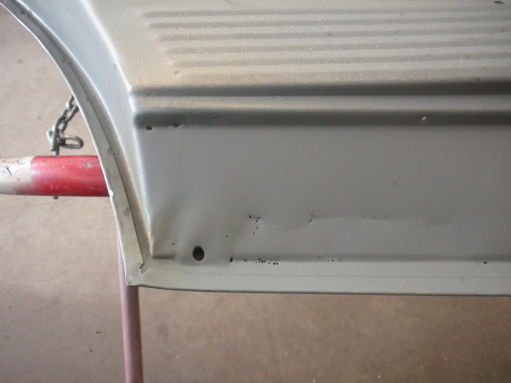 A close up of the bottom of a metal chair