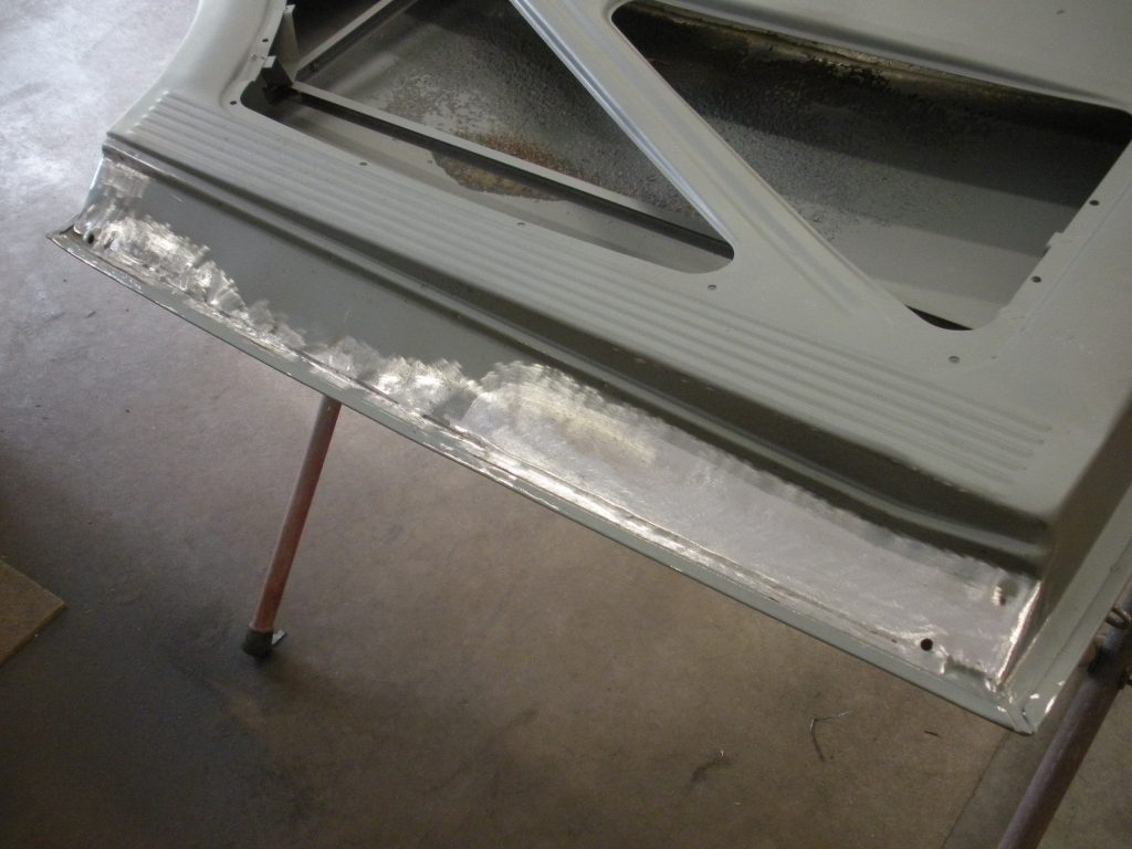 A metal table with some white paint on it