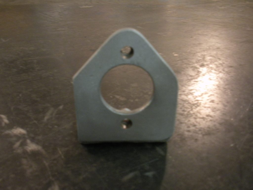 A metal object sitting on top of the floor.
