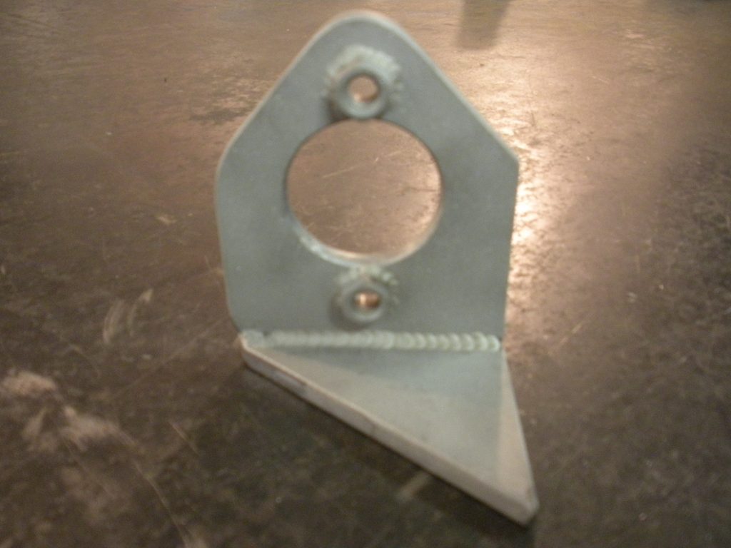 A metal object sitting on top of the floor.