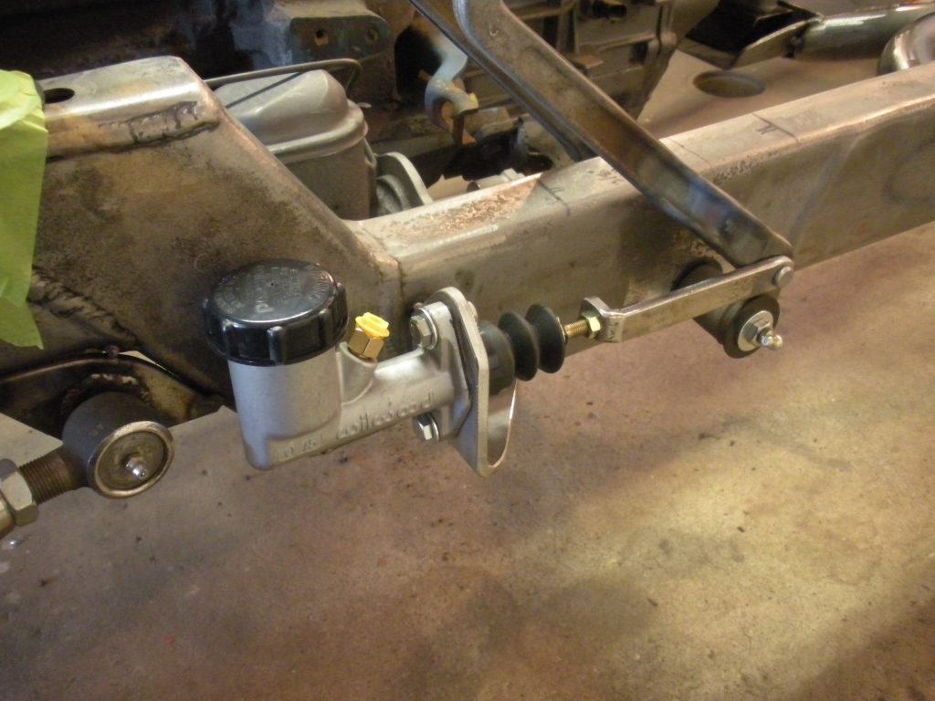 A close up of the steering wheel on an old car