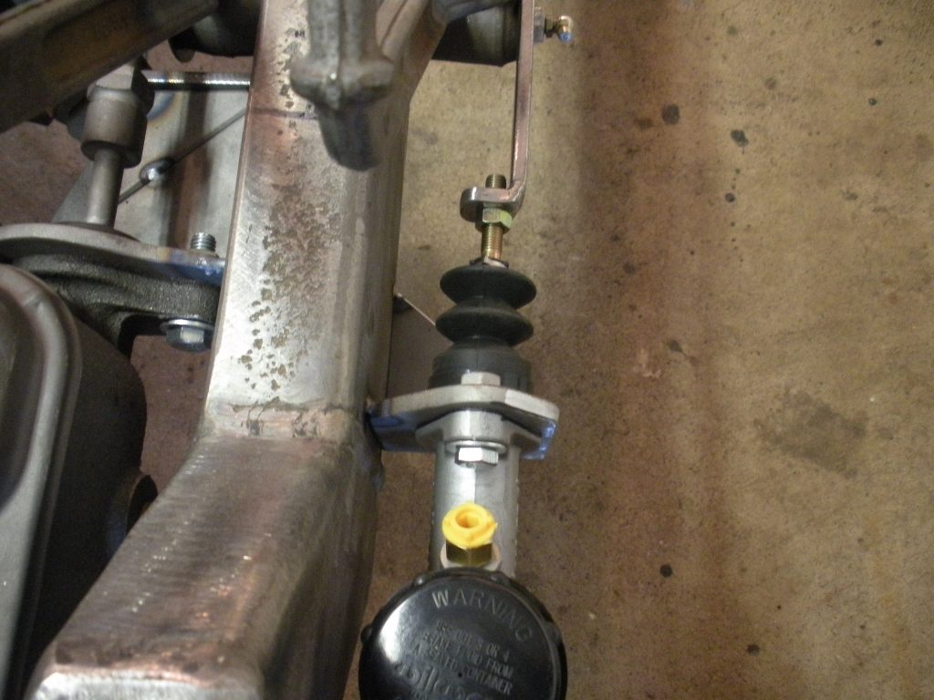 A close up of the brake and steering linkage