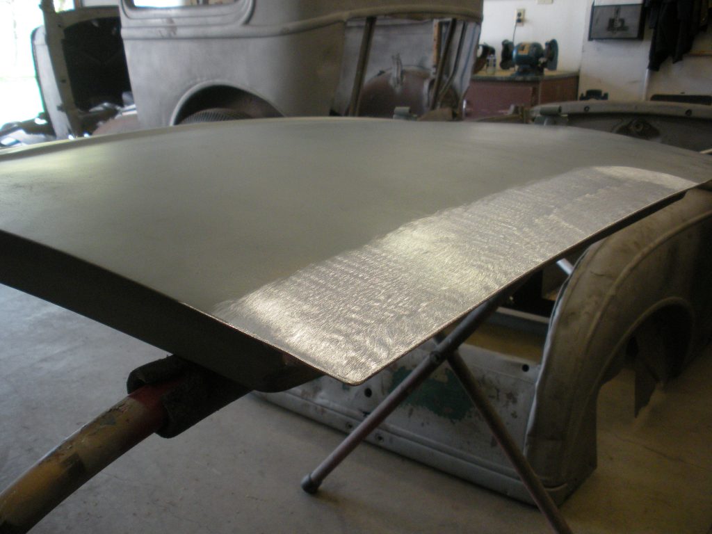 A table with metal sheet on top of it.