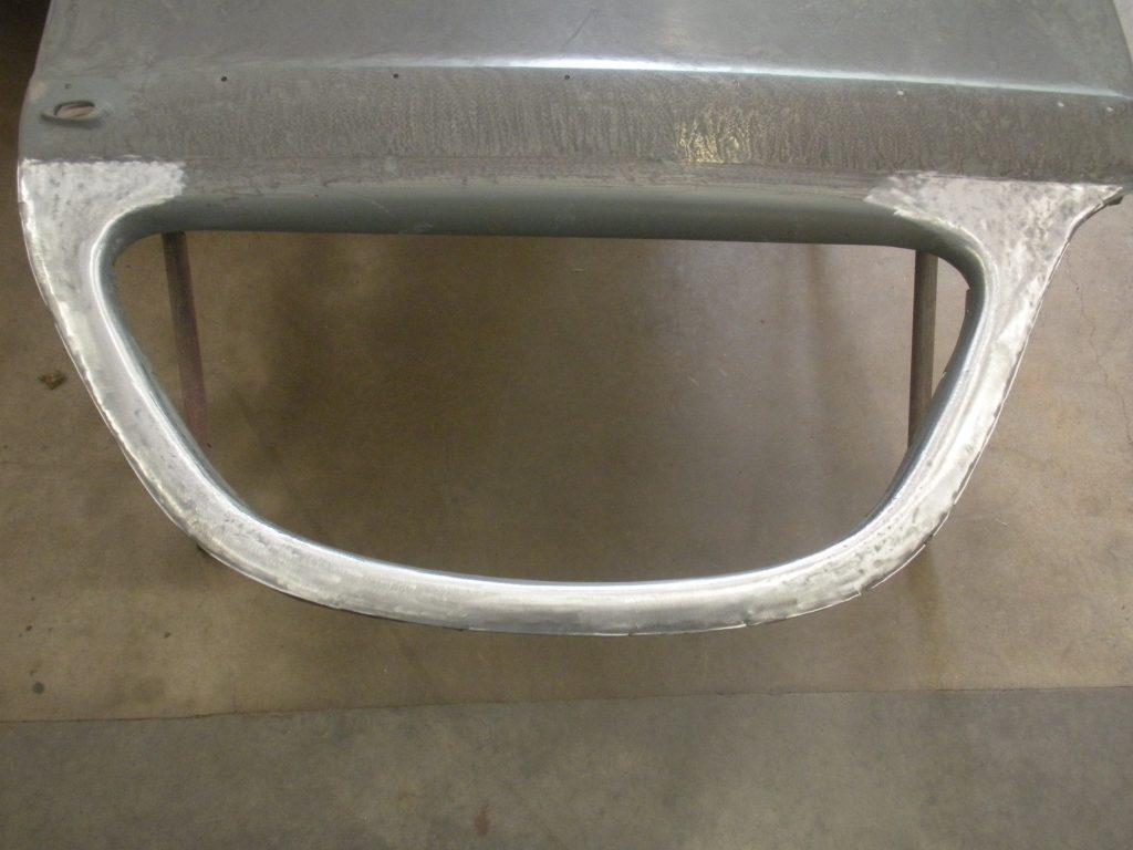 A metal handle on the side of a table.