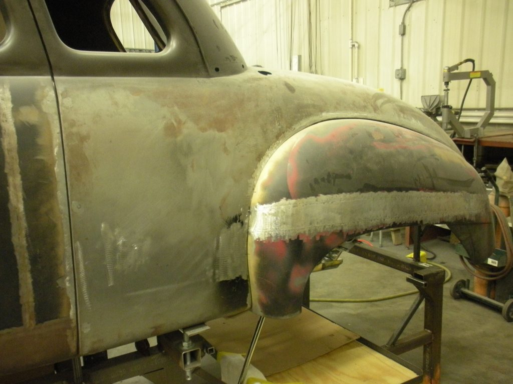 A car that is being worked on in the shop.