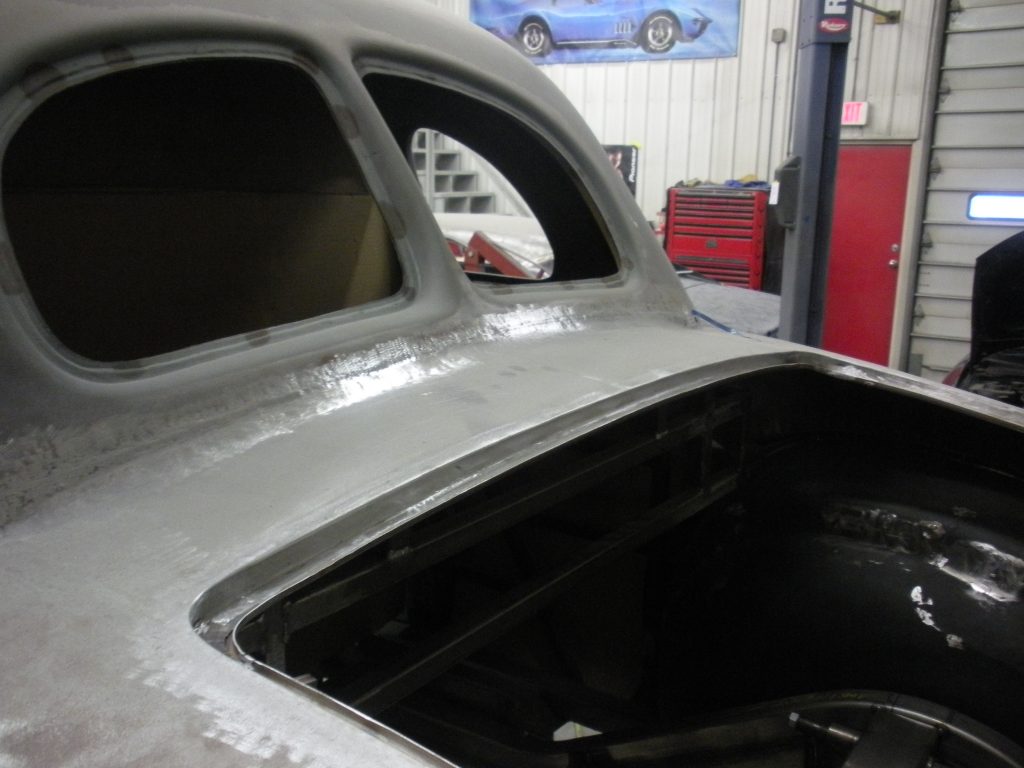 A car that is being worked on in the shop.