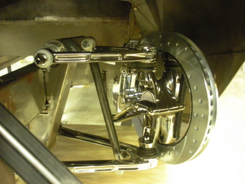 A close up of the front wheel on a car