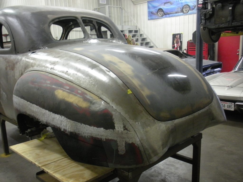 A car that is being worked on in the shop.