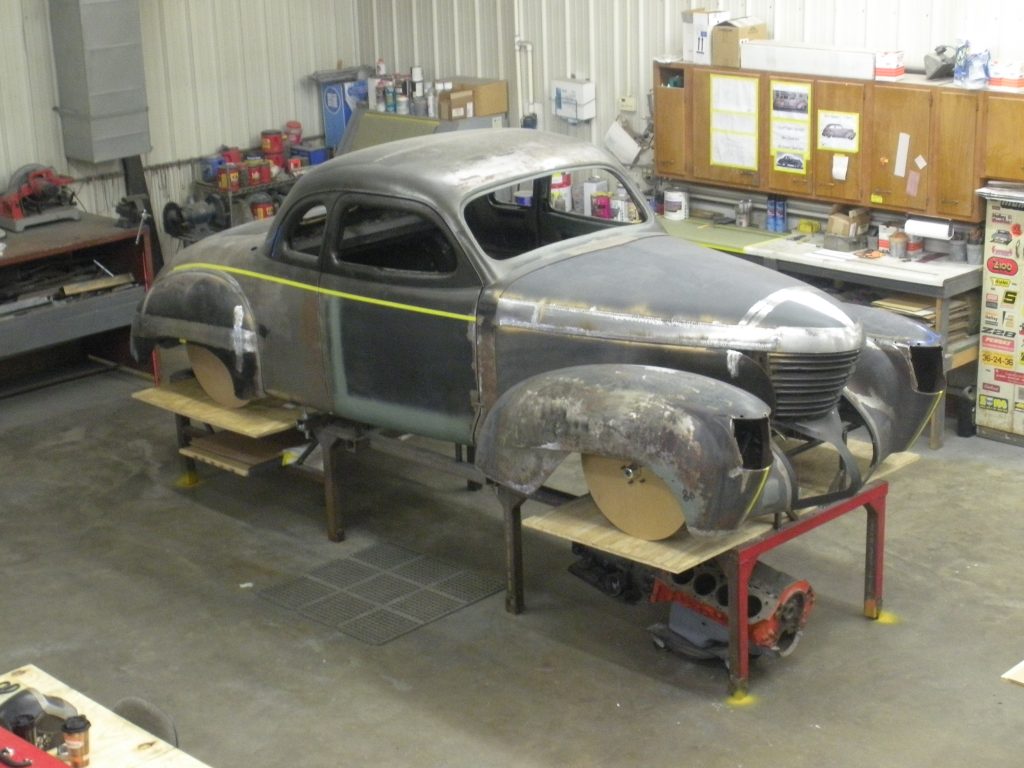A car is being built in the shop.