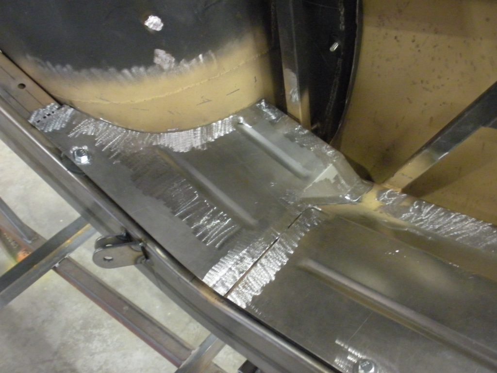 A metal machine with some tin foil on it