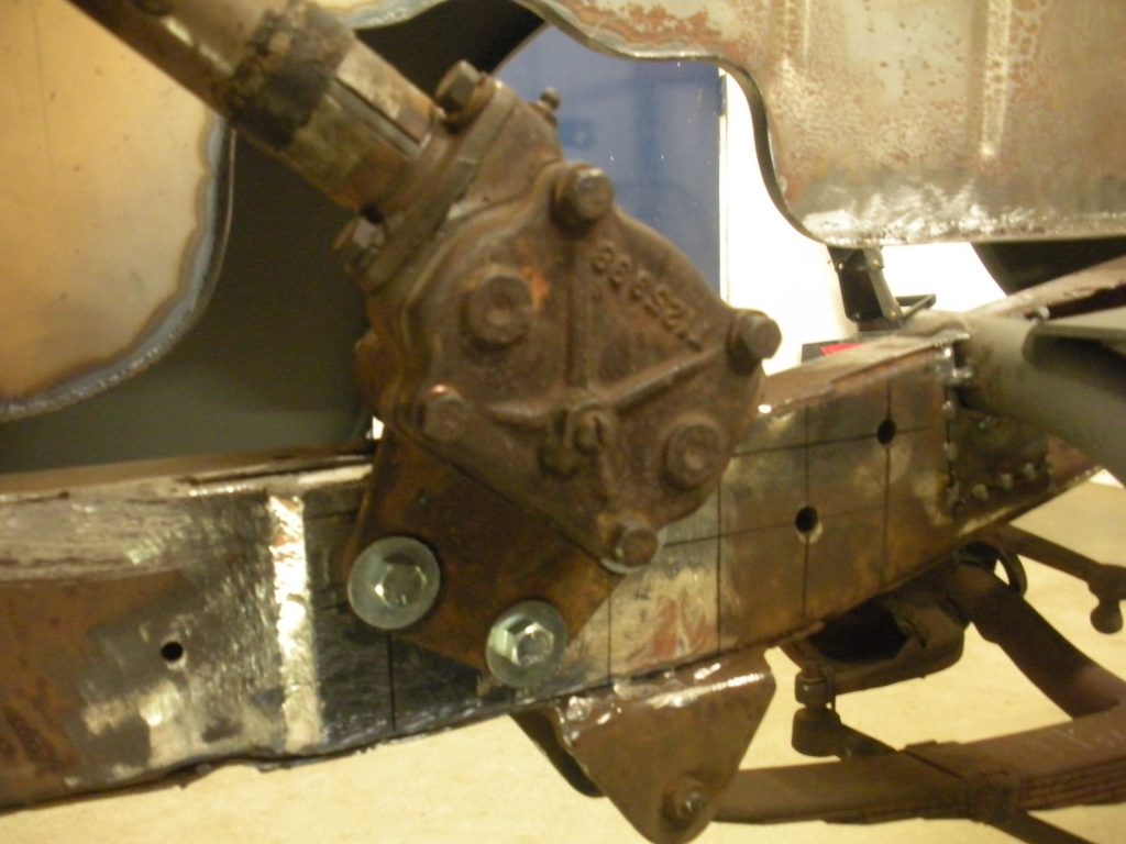 A close up of the front end of an old car.