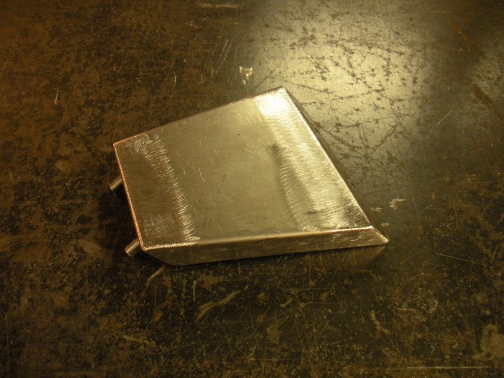 A book laying on the ground in a room.
