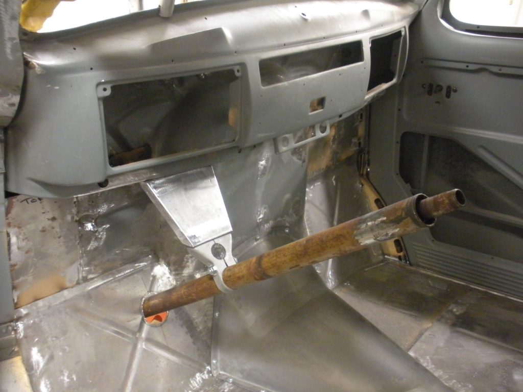 A piece of metal is being used to repair the interior.