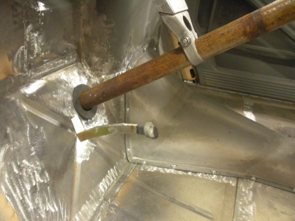 A metal pipe with some wood and a meter