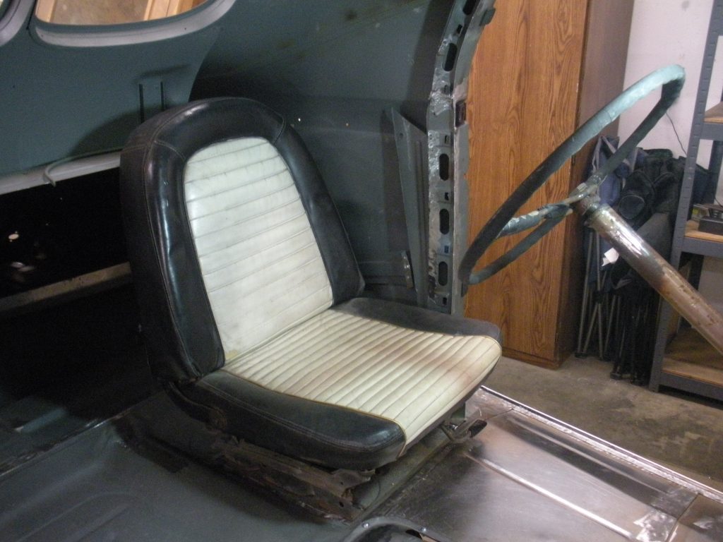 A black and white seat in an airplane.