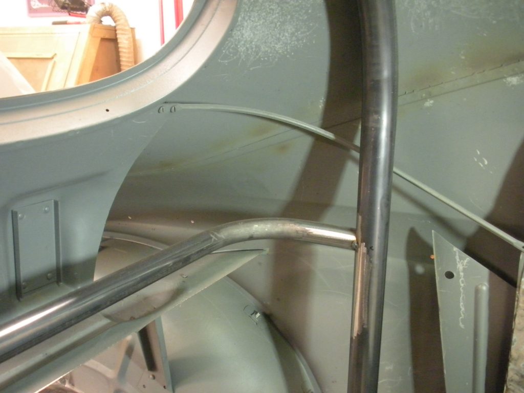 A metal staircase with a stainless steel railing.