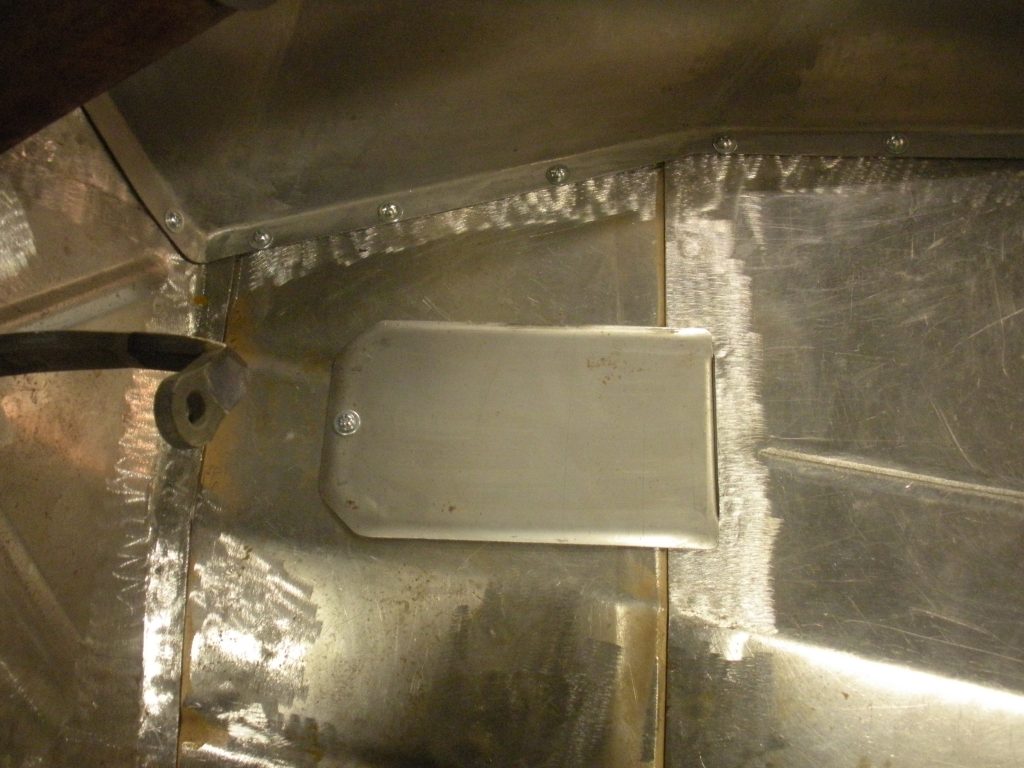 A metal door in the middle of an area.