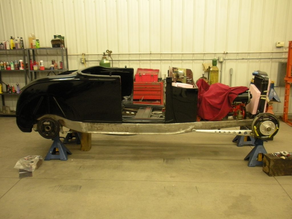A car is being worked on in the garage.