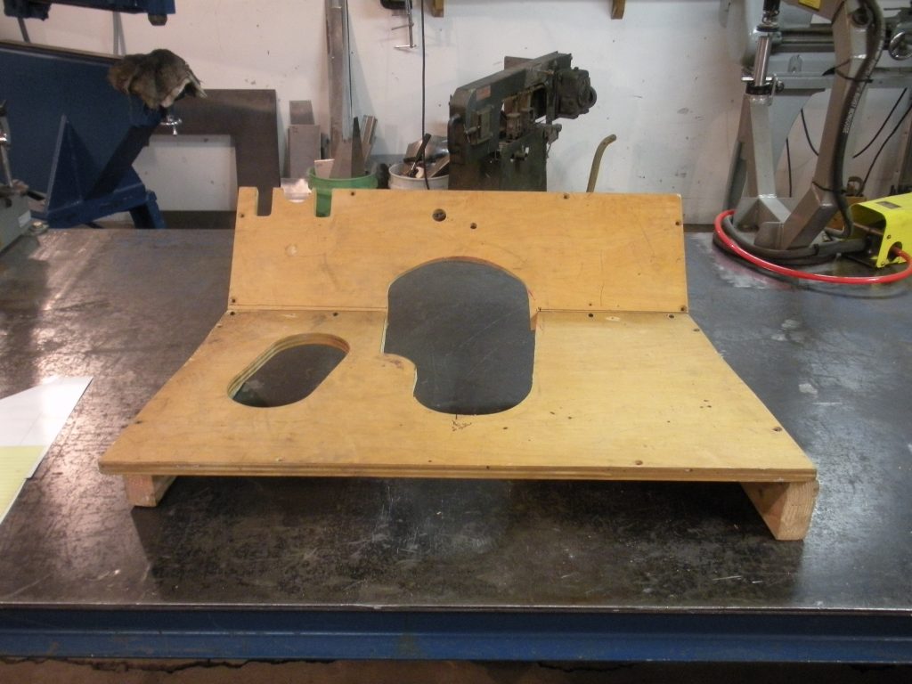 A wooden stand with two pieces of wood on it.