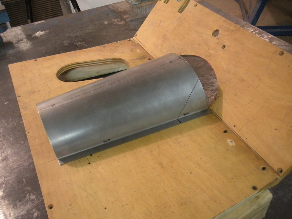 A piece of wood is being used to make a wooden box.
